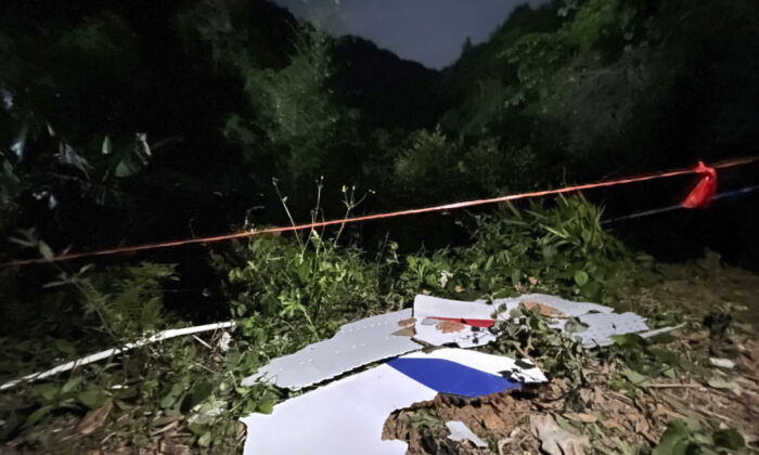 Debris is seen at the site of a plane crash in Tengxian County in southern China's Guangxi Province on March 22, 2022. (Zhou Hua/Xinhua via AP)