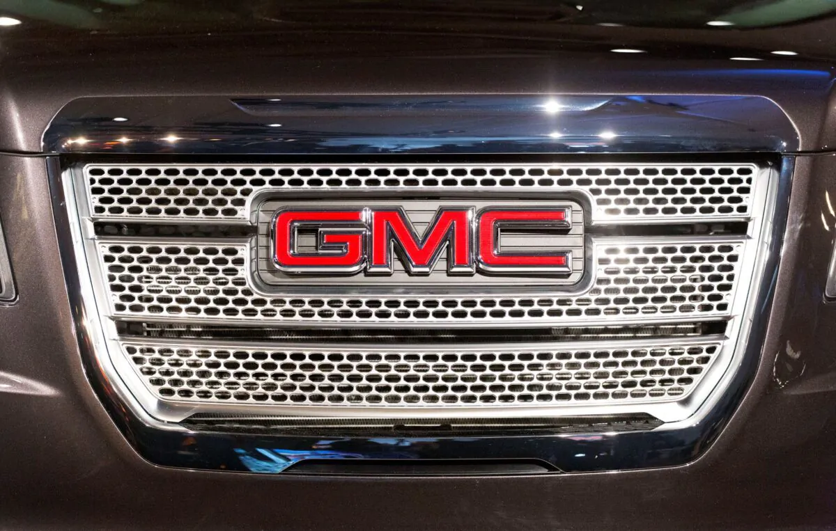 A GMC logo is displayed on the front grille of a vehicle at the New York International Auto Show, New York, on March 31, 2015. (Mark Lennihan/AP Photo)