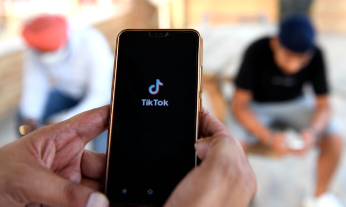 Users browse through the Chinese-owned video-sharing TikTok app on a smartphones in Amritsar, India, on June 30, 2020. (Narinder Nanu/AFP via Getty Images)
