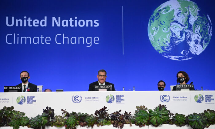 COP26 President Alok Sharma (C) speaks during the U.N. Climate Change Conference COP 26 in Glasgow, Scotland, on Nov. 13, 2021. (Jeff J Mitchell/Getty Images)