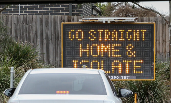 A sign reading 'Go straight home and Isolate' in Australia. (Asanka Ratnayake/Getty Images)