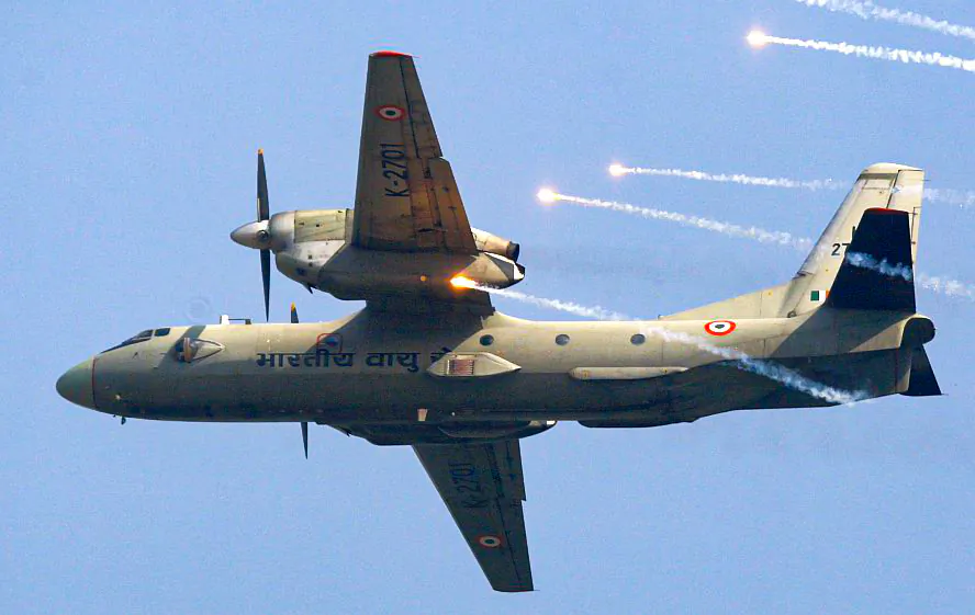 In this Thursday, Oct. 8, 2009, file photo, an Indian Air Force's (IAF) AN-32 transport aircraft releases chaff as it flies past the IAF Day Parade in New Delhi, India. (AP Photo/Mustafa Quraishi, file)
