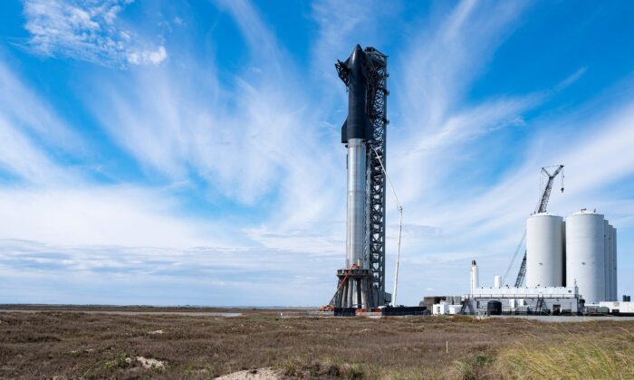 SpaceX's first orbital Starship SN20 is stacked atop its massive Super Heavy Booster 4 at the company's Starbase facility near Boca Chica Village in South Texas on Feb. 10, 2022. (Jim Watson/AFP via Getty Images)