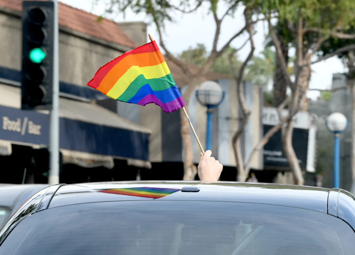 A person holds a rainbow flag in West Hollywood, Calif., on Nov. 7, 2020. (Kevin Winter/Getty Images)