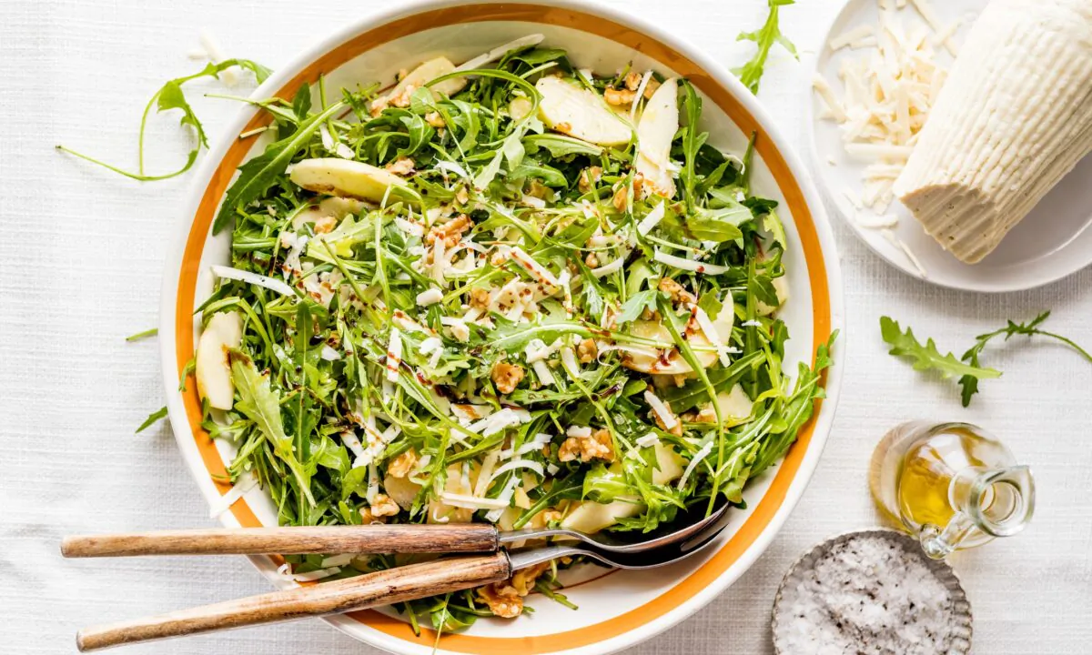 Peppery arugula, tart apple, and sweet-tangy balsamic combine into a fresh, balanced salad, finished with walnuts and milky ricotta salata. (Giulia Scarpaleggia)