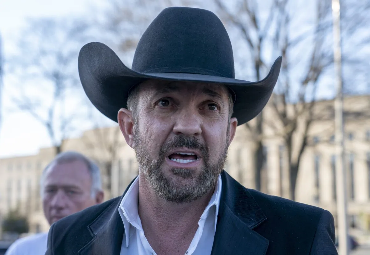 Otero County Commissioner Couy Griffin speaks to journalists as he leave federal court in Washington on March 21, 2022. (Gemunu Amarasinghe/AP Photo)