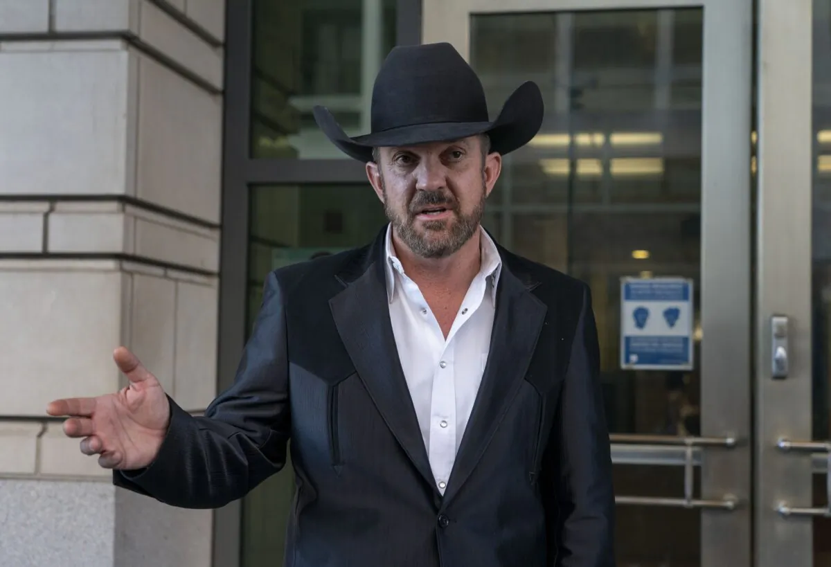 Otero County Commissioner Couy Griffin speaks to journalists as he leaves the federal court in Washington on March 21, 2022. (Gemunu Amarasinghe/AP Photo)