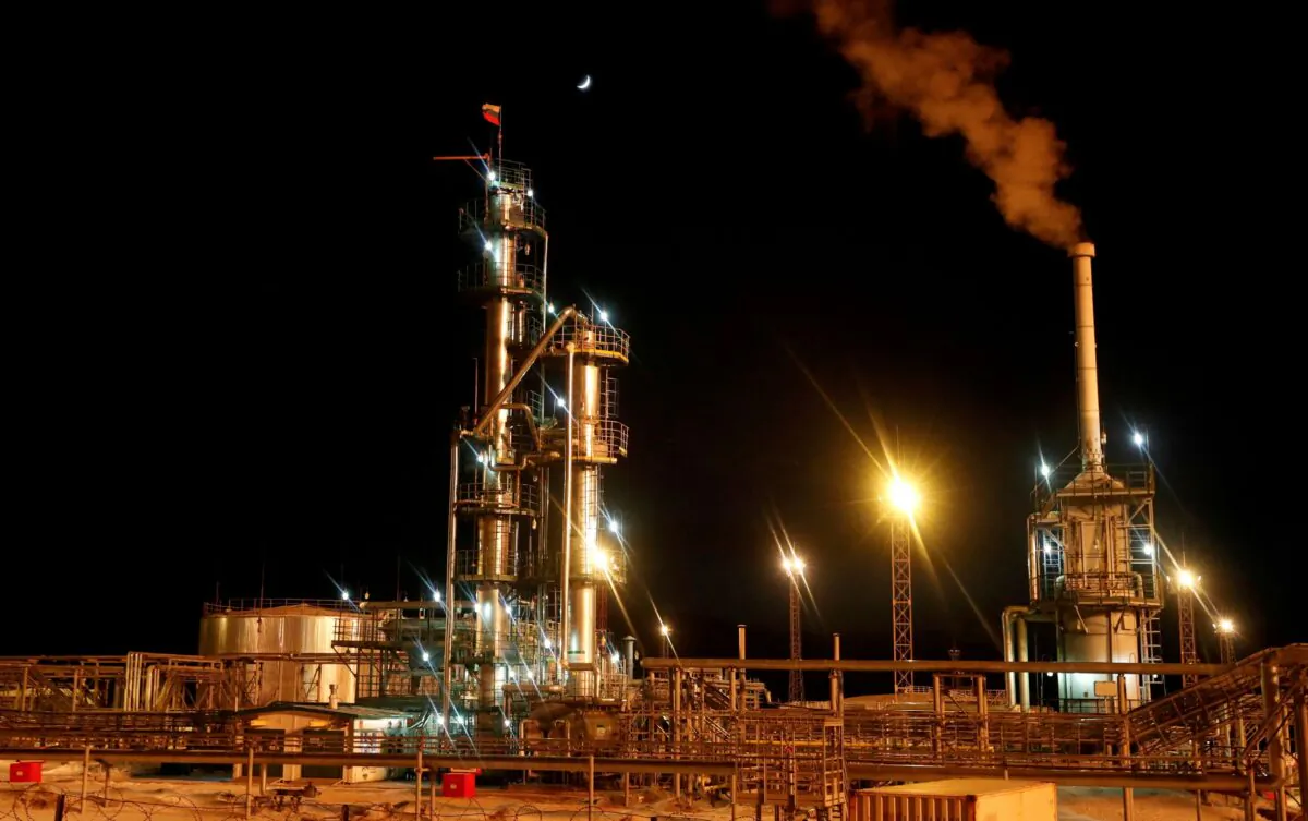 A Russian state flag flies on the top of a diesel plant in the Yarakta Oil Field, owned by Irkutsk Oil Company (INK), in Irkutsk Region, Russia, on March 10, 2019. (Vasily Fedosenko/Reuters)