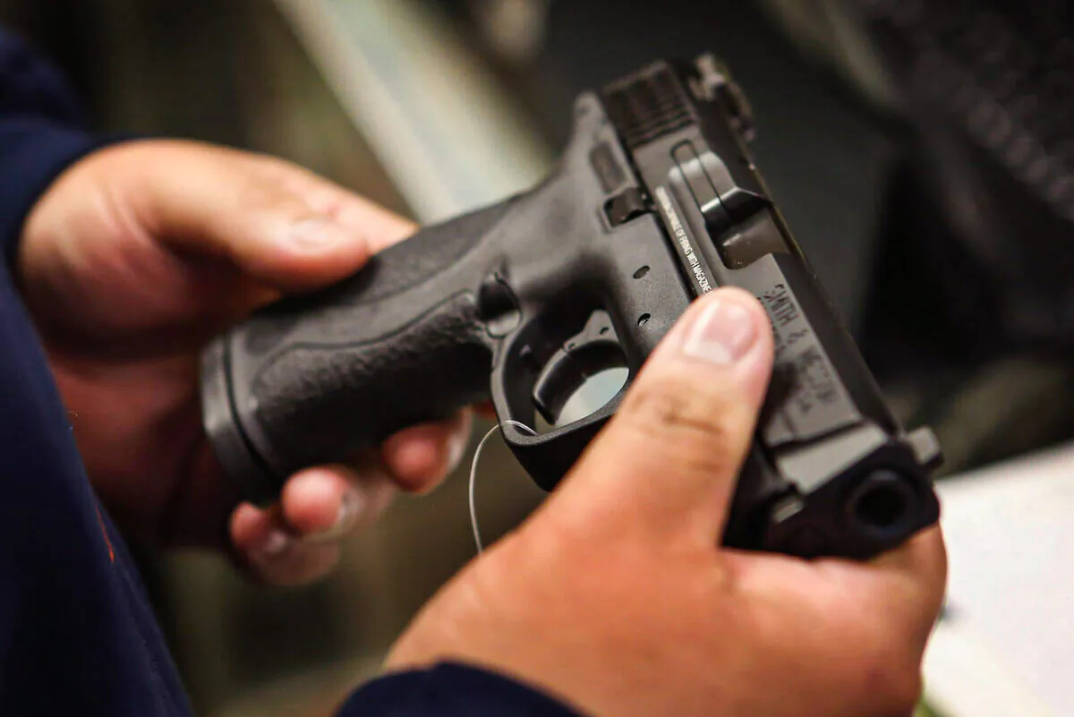 A customer shops for a pistol in Tinley Park, Ill., on Dec. 17, 2012. (Scott Olson/Getty Images)