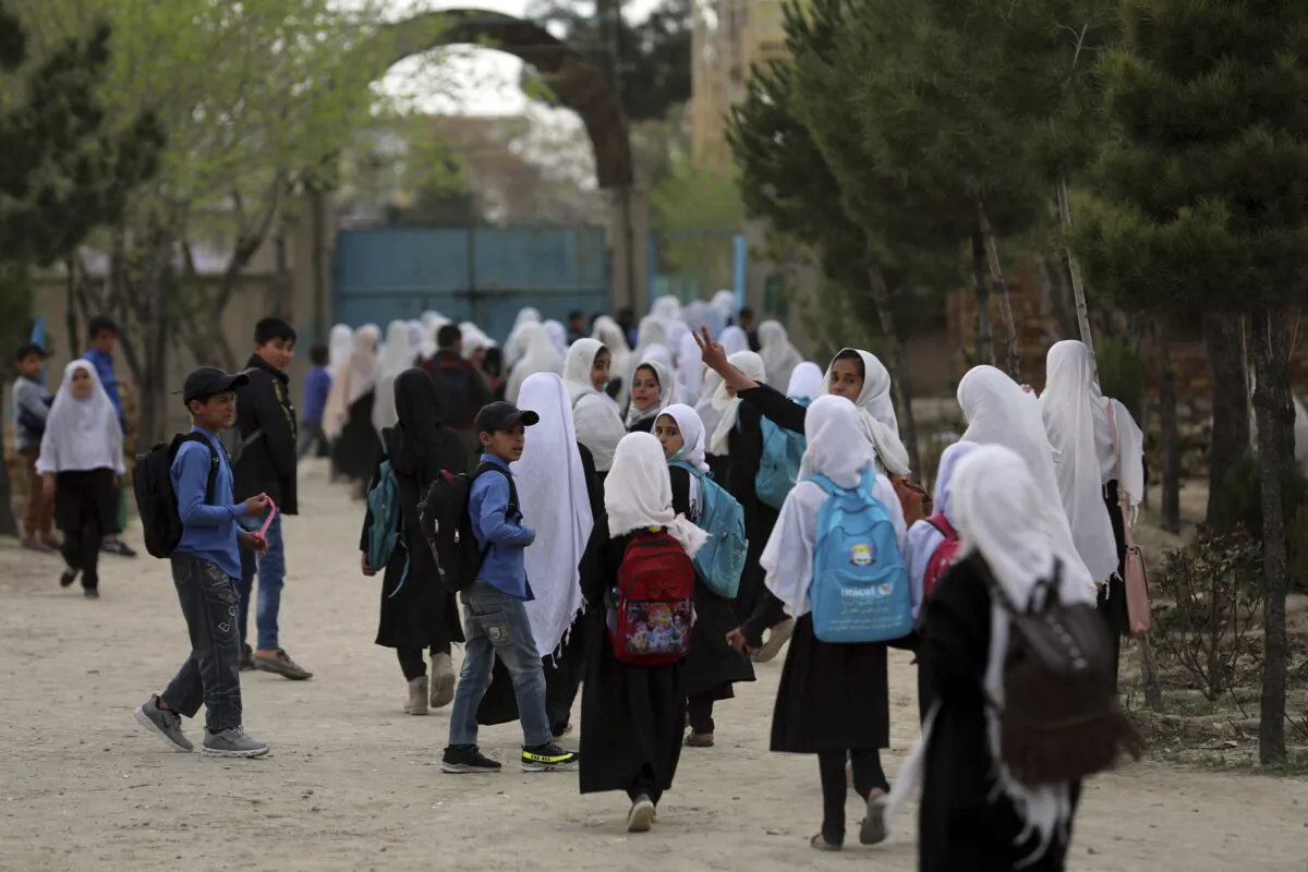 Afghan students leave school classes in a primary school in Kabul, Afghanistan on March 27, 2021. (Rahmat Gul/AP Photo)