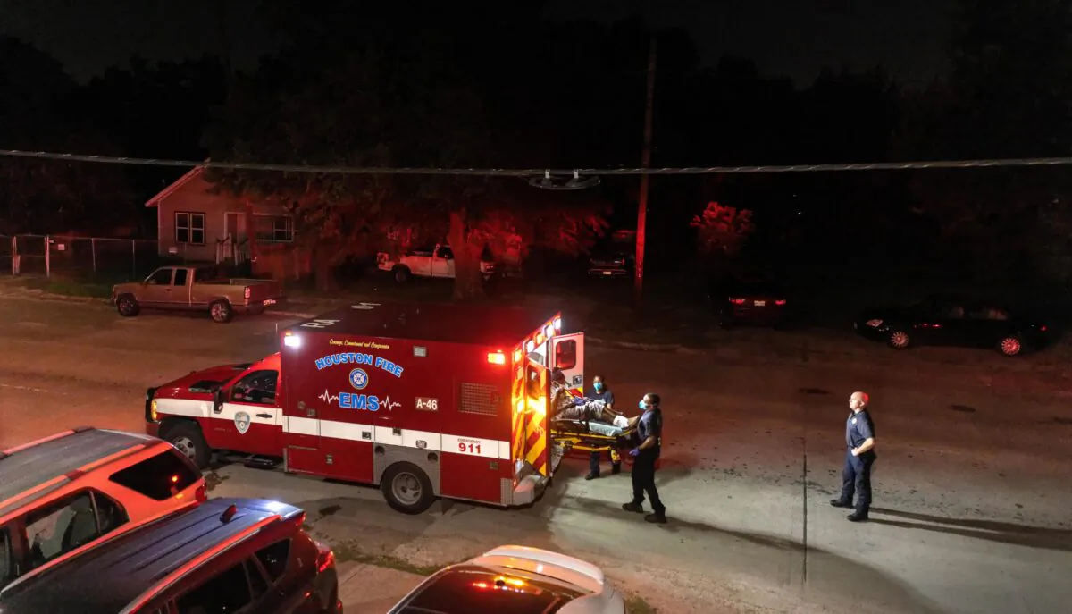 Houston Fire Department EMS medics load a patient into an ambulance in Houston, Texas, on Aug. 20, 2021. (John Moore/Getty Images)
