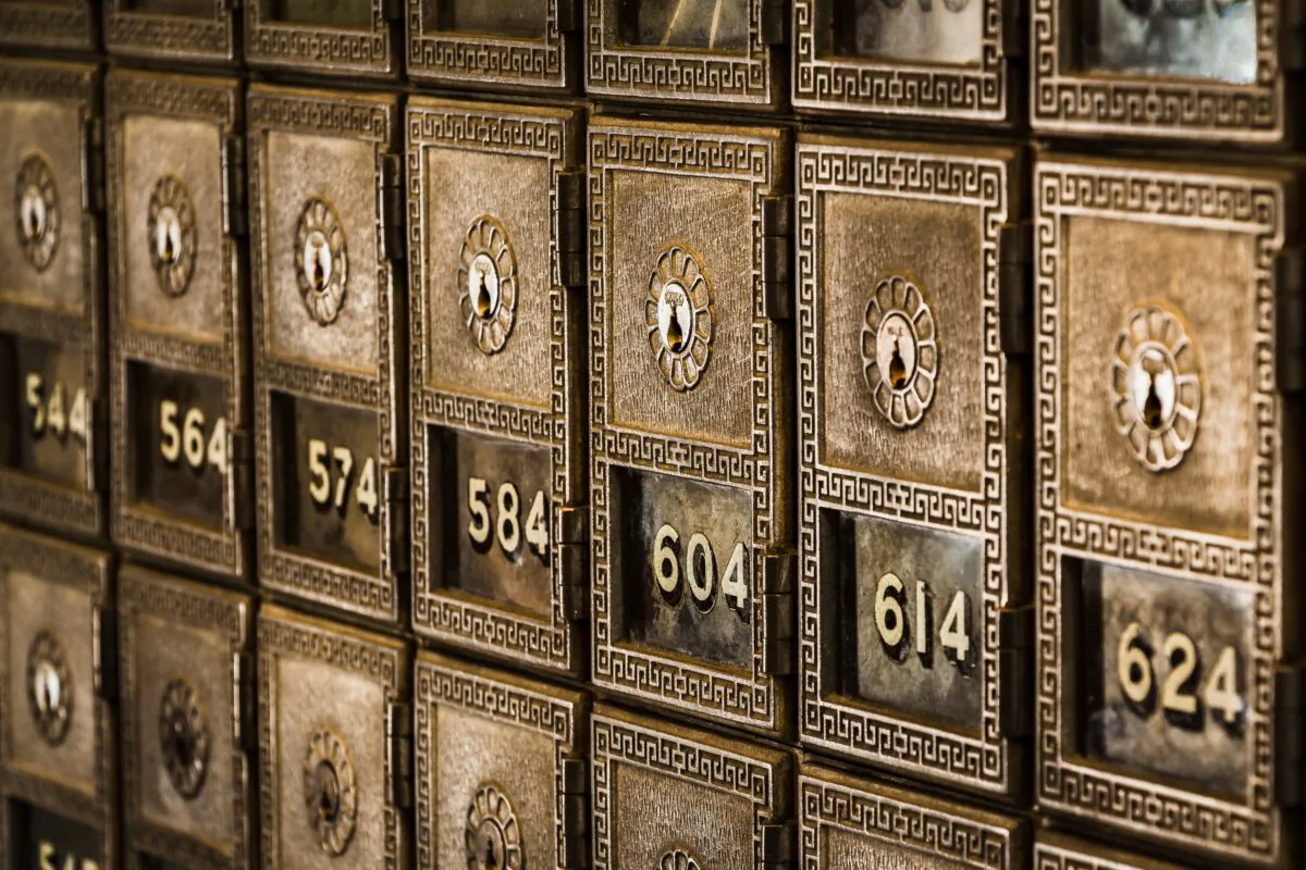 Stock photo of metal deposit boxes in a bank. (Tim Evans/Unsplash)