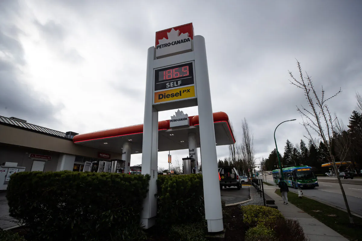 A sign displays $1.87 as the price of a litre of regular-grade gasoline at a Petro-Canada gas station, in Burnaby, B.C., on March 2, 2022. (Darryl Dyck/The Canadian Press)