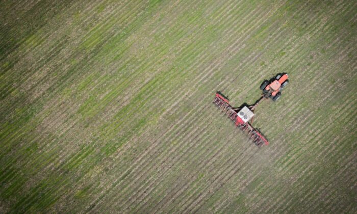 Tractor crossing an Iowa field for spring corn planting. (Courtesy Iowa Corn Growers Association)