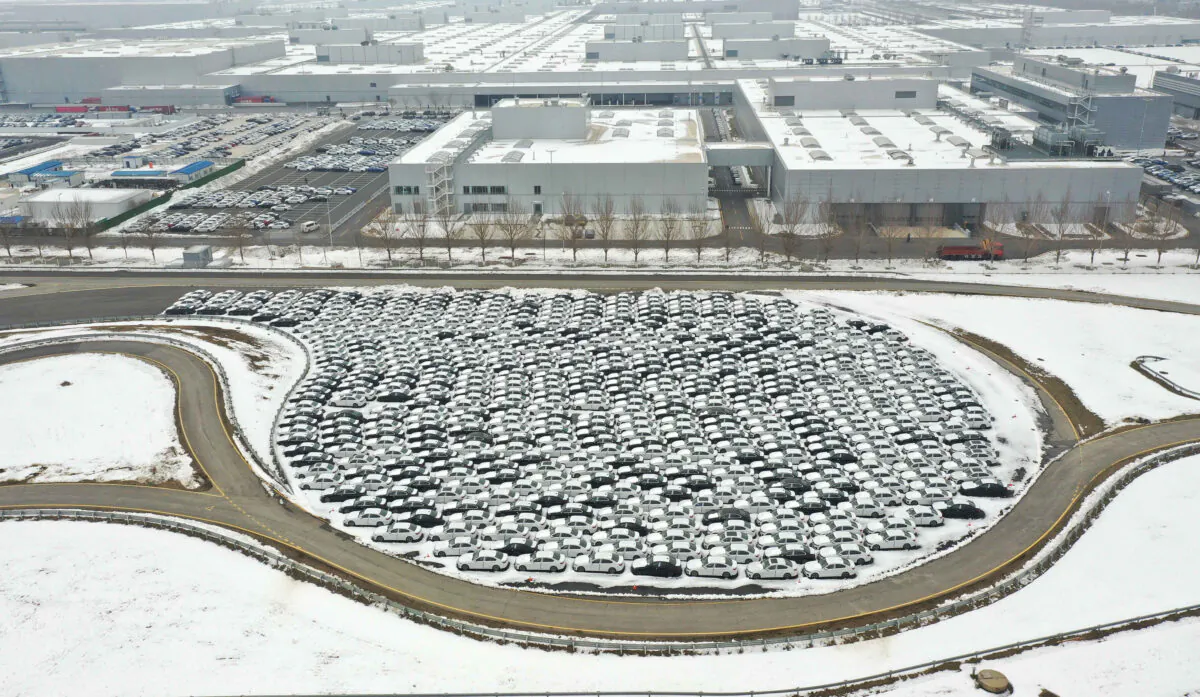 This aerial photo shows newly produced cars lined up surrounded by recent snow at a BMW factory in Shenyang in China's northeastern Liaoning Province on Nov. 17, 2021. (STR/AFP via Getty Images)