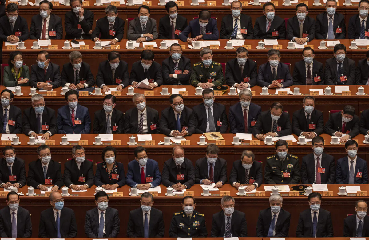 Delegates take part in the closing session of the Chinese People's Political Consultative Conference (CPPCC) at the Great Hall of the People in Beijing on March 10, 2022. (Kevin Frayer/Getty Images)