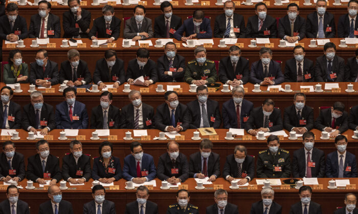 Delegates participate in the closing session of the Chinese People's Political Consultative Conference (CPPCC) at the Great Hall of the People in Beijing, China, on March 10, 2022. (Kevin Frayer/Getty Images)