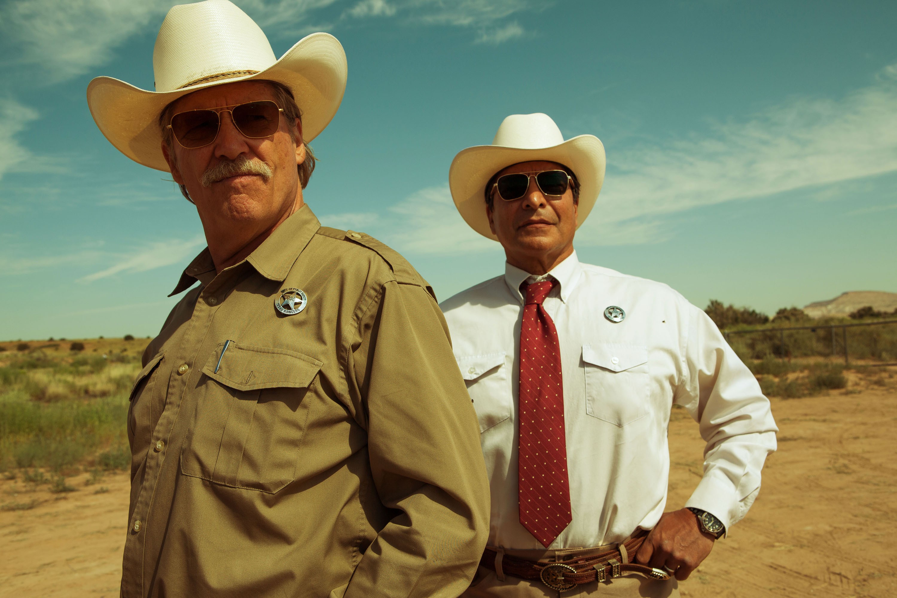 two men with sunglasses and Stetson hats in high or high water