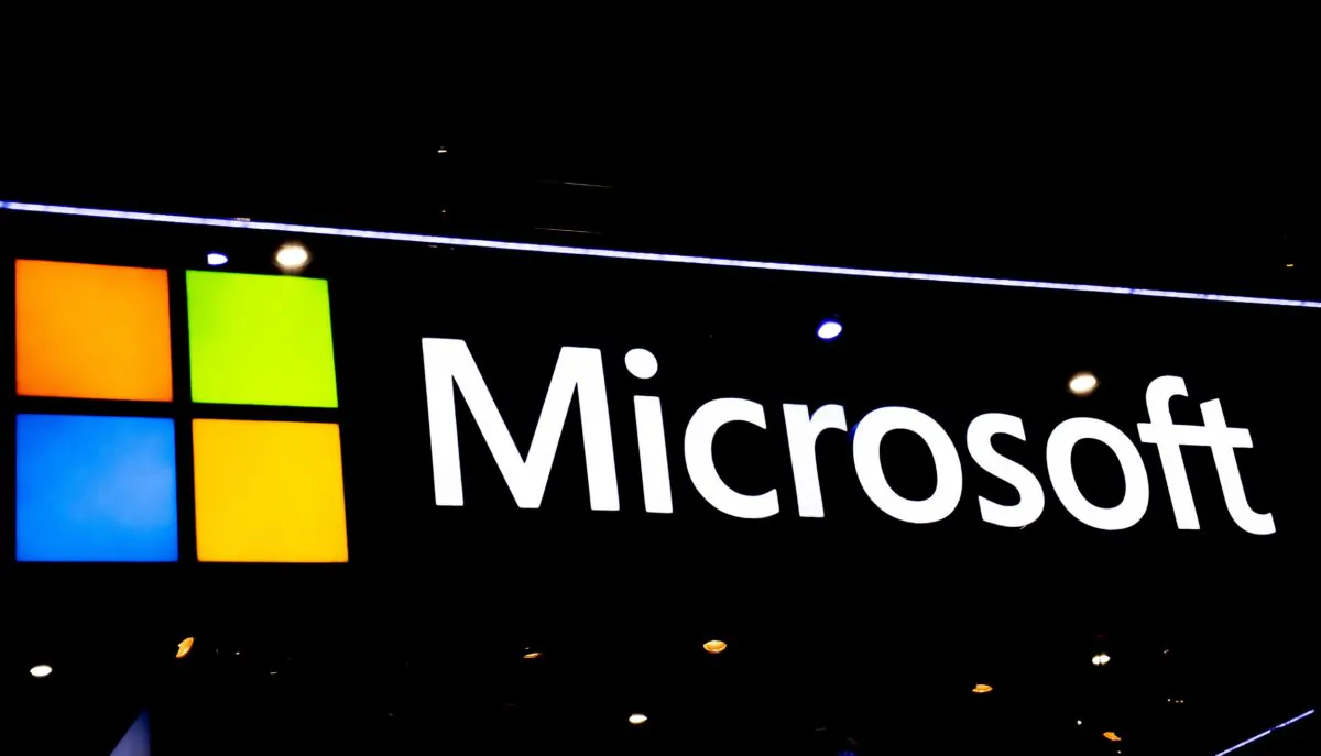 A Microsoft logo sits illuminated at the SK telecom booth during the GSMA Mobile World Congress in Barcelona, Spain, on Feb. 28, 2022. (David Ramos/Getty Images)