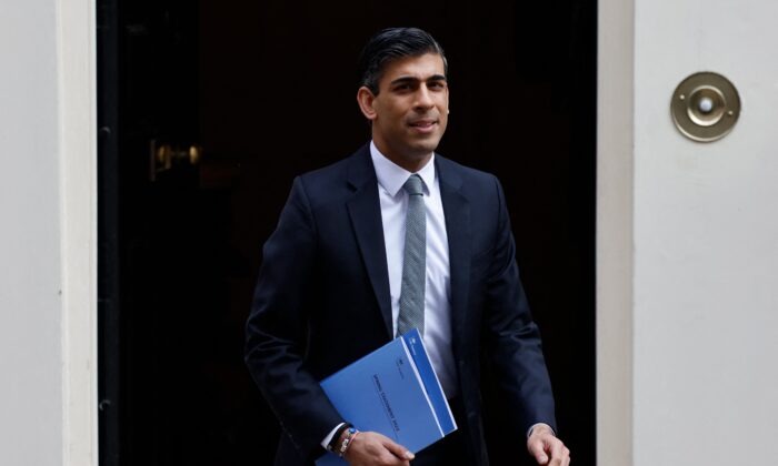 Britain's Chancellor of the Exchequer Rishi Sunak leaves the 11 Downing Street to announce budget updates in the House of Commons, in London, on March 23, 2022. (Tolga Akmen /AFP via Getty Images)