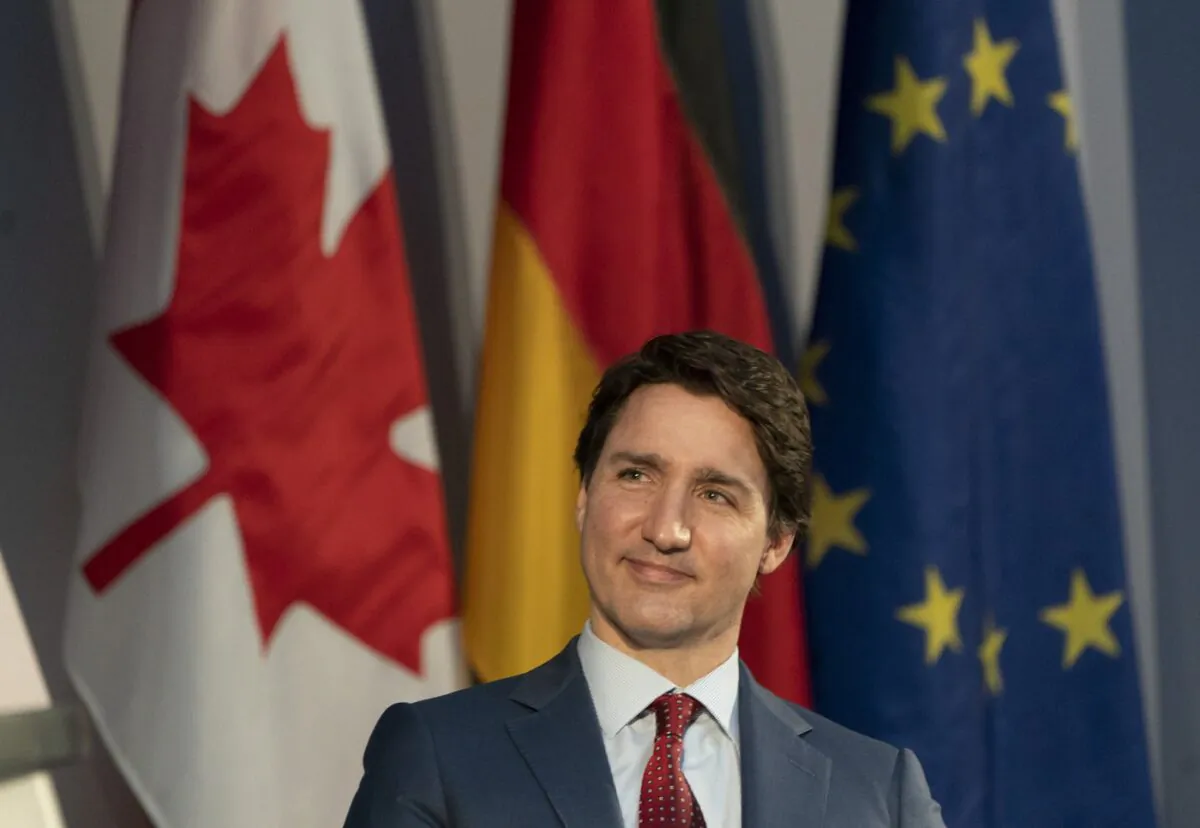 Canadian Prime Minister Justin Trudeau smiles as he listens to a speaker at an event in Berlin, Germany, March 9, 2022. (The Canadian Press/Adrian Wyld)