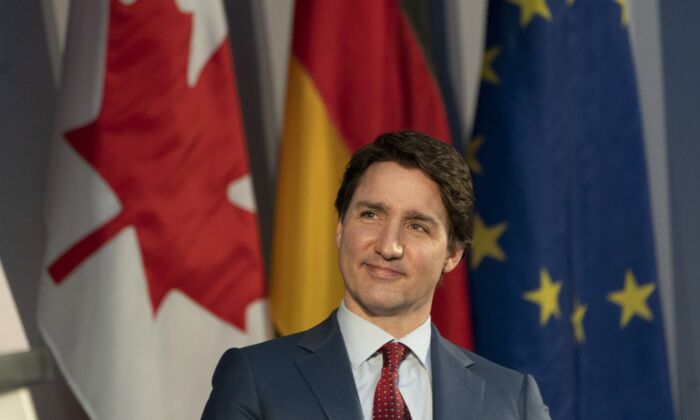 Canadian Prime Minister Justin Trudeau smiles as he listens to a speaker at an event in Berlin, Germany, March 9, 2022. (The Canadian Press/Adrian Wyld)