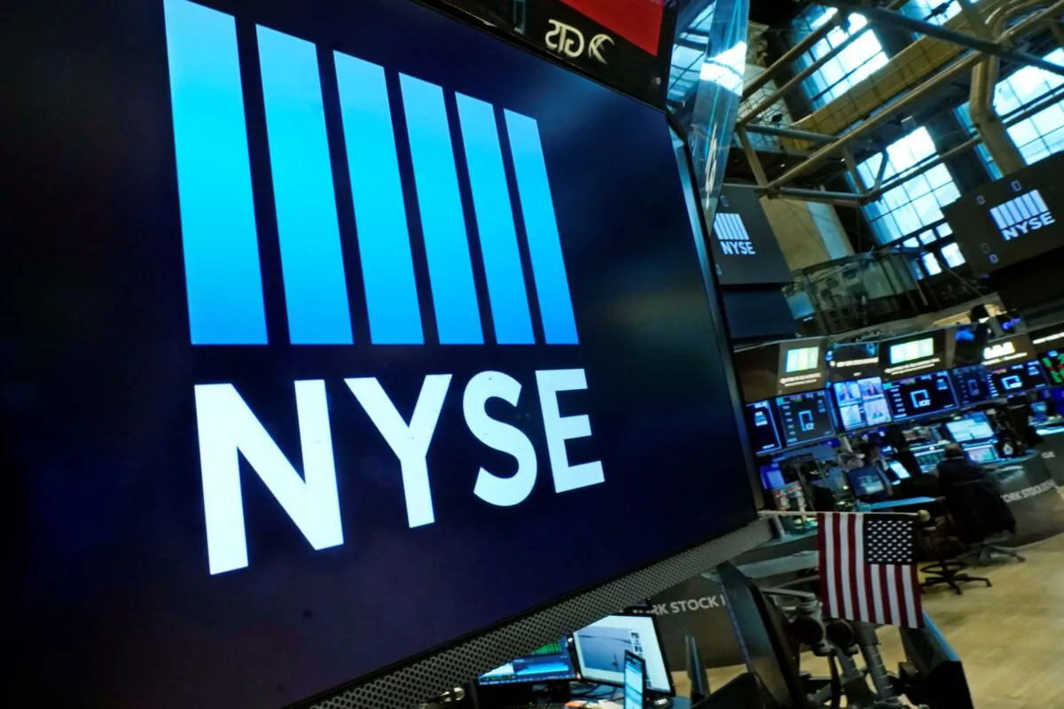 The New York Stock Exchange logo adorns trading posts on the floor on March 16, 2022. (Richard Drew/AP Photo)