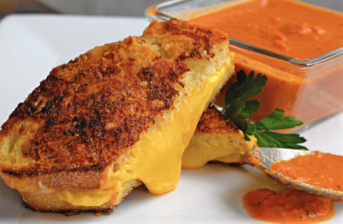 The top side of the Frico-Crusted Grilled Cheese sandwich is covered in a layer of cheese and then toasted until crispy. This gives your grilled cheese an extra cheesy and crunchy factor. (Courtesy to Melissa Elsmo / Pioneer Press)