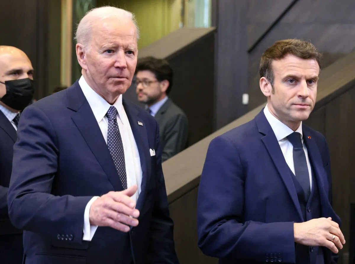 U.S. President Joe Biden (left) and French President Emmanuel Macron arrive to attend a North Atlantic Council meeting during a NATO summit at NATO Headquarters in Brussels on March 24, 2022. (Thomas Coex/AFP via Getty Images)