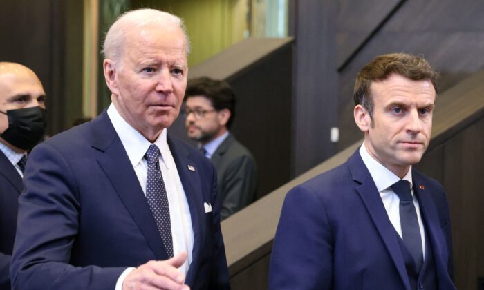 U.S. President Joe Biden (L) and French President Emmanuel Macron arrive to attend a North Atlantic Council meeting during a NATO summit at NATO Headquarters in Brussels on March 24, 2022. (Thomas Coex/AFP via Getty Images)