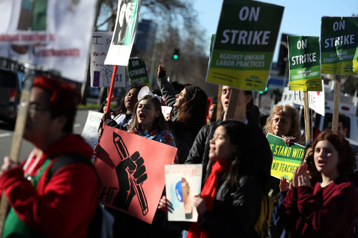 Students join striking teachers as they demand higher pay and smaller class sizes outside Oakland Technical High School in Oakland, Calif., on Feb. 21, 2019. (Justin Sullivan/Getty Images)