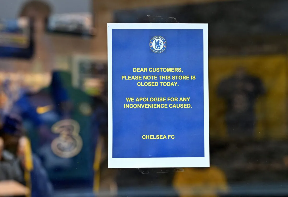 Signs on doors alert fans that the Club shop is closed at Stamford Bridge, the home ground of Chelsea football club, ahead of their English Premier League football match against Newcastle United, in London, on March 13, 2022. (Justin Tallis/Getty Images)