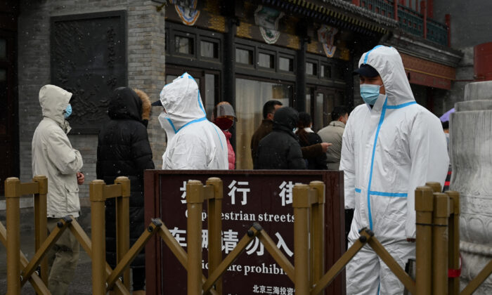People queue to get a swab test for the Covid-19 coronavirus in Beijing on March 17, 2022. (Noel Celis/AFP via Getty Images)