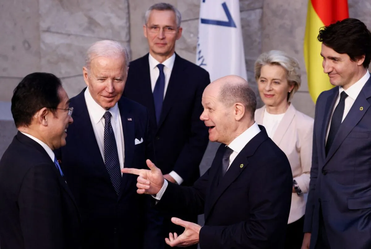 Japan's Prime Minister Fumio Kishida, U.S. President Joe Biden, and Germany's Chancellor Olaf Scholz speak next to NATO Secretary General Jens Stoltenberg, European Commission President Ursula von der Leyen, and Canada's Prime Minister Justin Trudeau are seen in Brussels, Belgium, on on March 24, 2022.  (Henry Nicholls/ Pool/Getty Images)