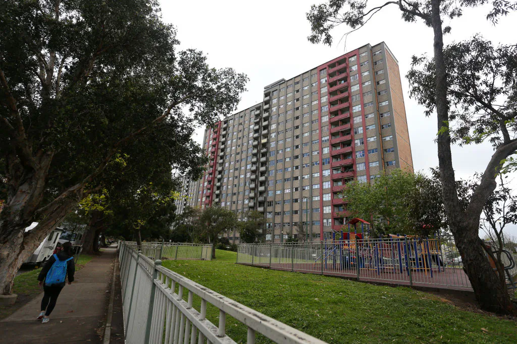 A person walks past a public housing tower on Morehead Street in Sydney, Australia, on Sep. 16, 2021. (Lisa Maree Williams/Getty Images)