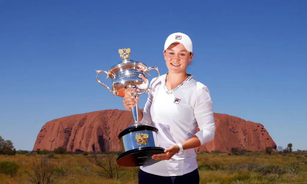 Ash Barty poses with the Daphne Akhurst Memorial Cup as she visits Uluru in the Uluru-Kata Tjuta National Park, Australia on Friday, February 25, 2022. (Photo by Scott Barbour/Tennis Australia via Getty Images)