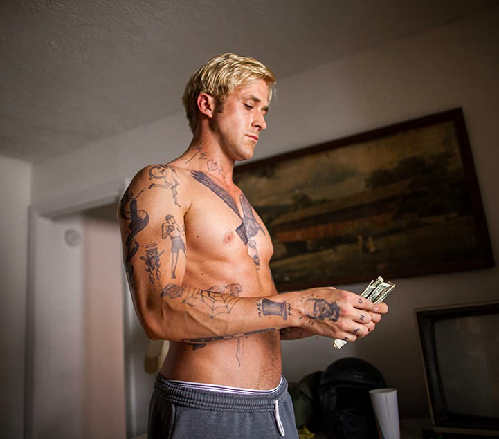 shirtless man counts money in THE PLACE BEYOND THE PINES
