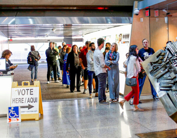 Voters wait to cast their midterm elections ballots at Burton Barr Library, a polling station in Phoenix, Arizona