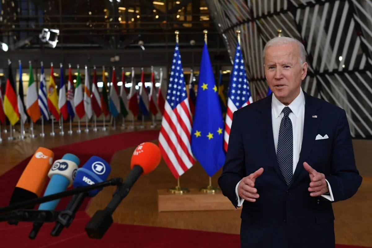 President Joe Biden addresses media representatives as he arrives for a European Union (EU) summit at EU Headquarters in Brussels, on March 24, 2022. (John Thys/AFP via Getty Images)