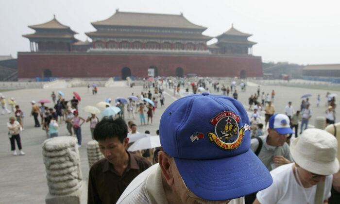 Retired U.S. Air Force pilots who carried out missions in China during World War II visit the Forbidden City in Beijing, China, on Aug. 14, 2005. A group of 270 World War II veterans from the U.S. who had supported the Chinese army to fight against the Japanese invasion, including members of the American Volunteer Group Flying Tigers, are visiting China to attend events celebrating the anniversary of the Anti-Fascist War victory. (China Photos/Getty Images)