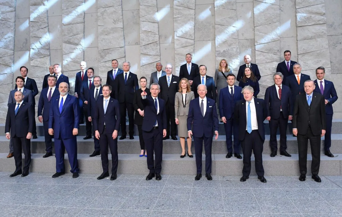 (front R) Turkey's President Recep Tayyip Erdogan, Britain's Prime Minister Boris Johnson, President Joe Biden, NATO Secretary General Jens Stoltenberg, Belgium's Prime Minister Alexander De Croo with the leaders of the U.S.-led military alliance pose for a family photo at NATO Headquarters in Brussels, on March 24, 2022. (John Thys/AFP via Getty Images)