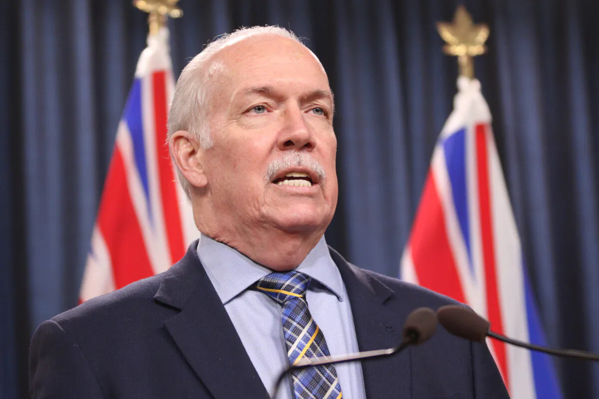 B.C. Premier John Horgan answers questions during a news conference at the legislature in Victoria on March 11, 2022. (Chad Hipolito/The Canadian Press)