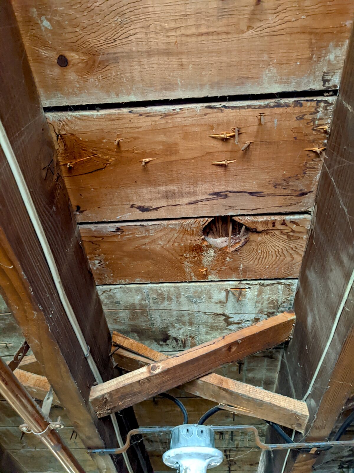 How could the underside of the original subfloor in this old house be stained by concrete? You’ll be amazed to discover the answer. (Courtesy to Tim Carter/TNS)