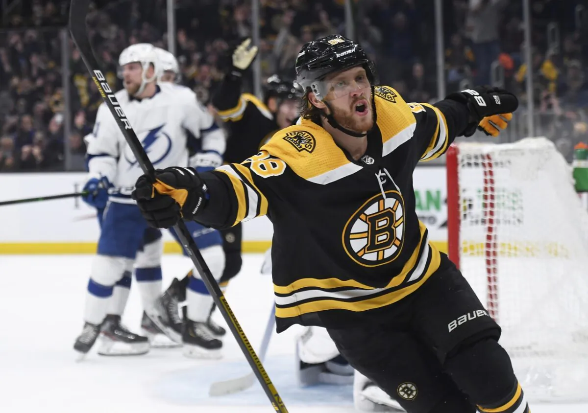Boston Bruins right wing David Pastrnak (88) reacts after scoring a goal for a hat trick during the third period against the Tampa Bay Lightning at TD Garden in Boston on March 24, 2022. (Bob DeChiara/USA TODAY Sports via Field Level Media)