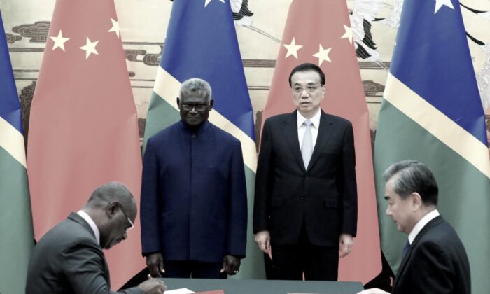 (L-R) Solomon Islands Prime Minister Manasseh Sogavare, Solomon Islands Foreign Minister Jeremiah Manele, Chinese Premier Li Keqiang and Chinese State Councillor and Foreign Minister Wang Yi attend a signing ceremony at the Great Hall of the People in Beijing, China, on Oct. 9, 2019.  (Thomas Peter-Pool/Getty Images)