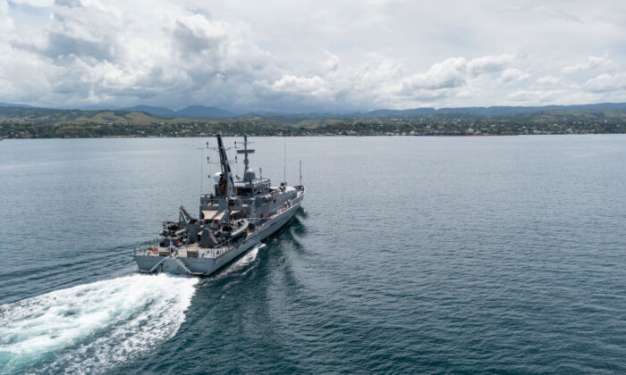 In this handout provided by the Australian Department of Defence, Armadale Class Patrol Boat, HMAS Armidale, sails into the Port of Honiara, Guadalcanal Island, Solomon Islands, on Dec. 1, 2021. (CPL Brodie Cross/Australian Department of Defence via Getty Images)