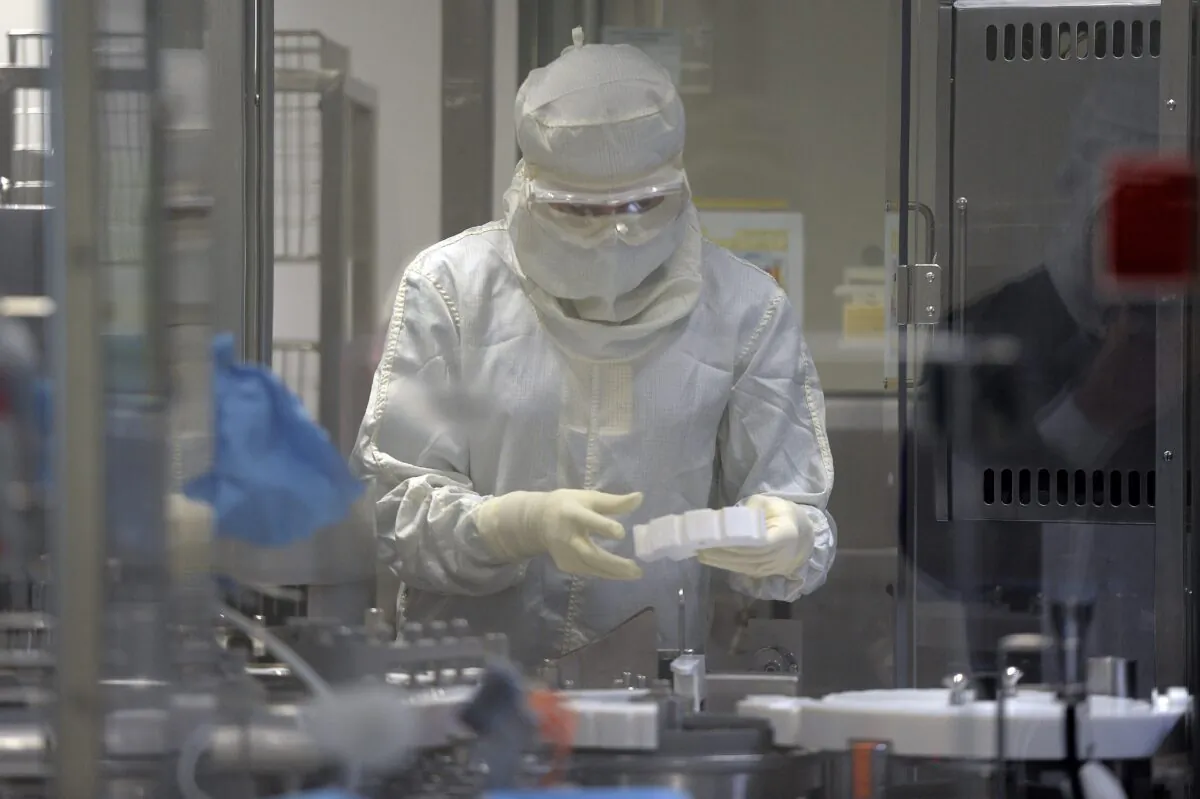 An employee works in an unit dedicated to the production of insulin pens at the factory of the U.S. pharmaceutical company Eli Lilly in Fegersheim, eastern France, on Oct. 12, 2015.  (Frederick Florin/AFP via Getty Images)