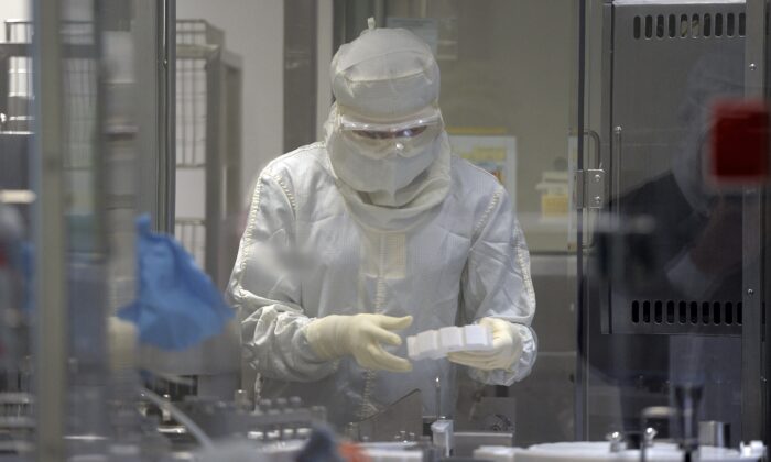 An employee works in an unit dedicated to the production of insulin pens at the factory of the U.S. pharmaceutical company Eli Lilly in Fegersheim, eastern France, on Oct. 12, 2015.  (Frederick Florin/AFP via Getty Images)
