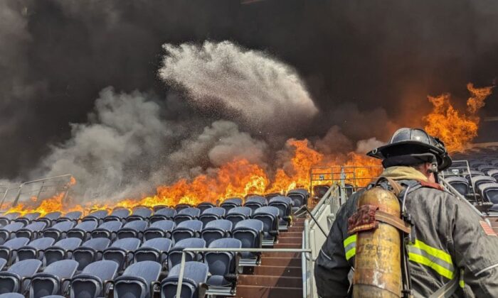 Seats at Empower Field in Denver caught fire Thursday afternoon. (Denver Fire Department)