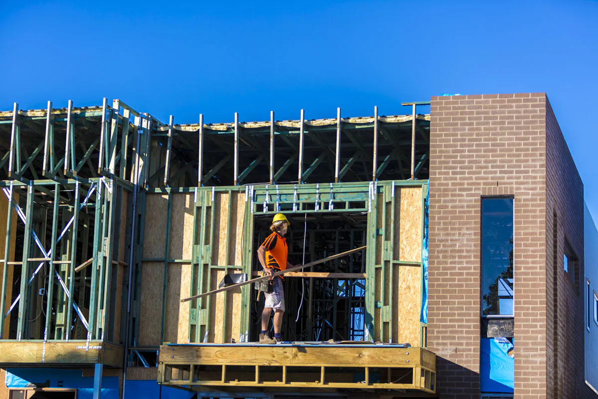 People work on new housing at North Lakes in Brisbane, Australia, on June 10, 2016. (Glenn Hunt/Getty Images)